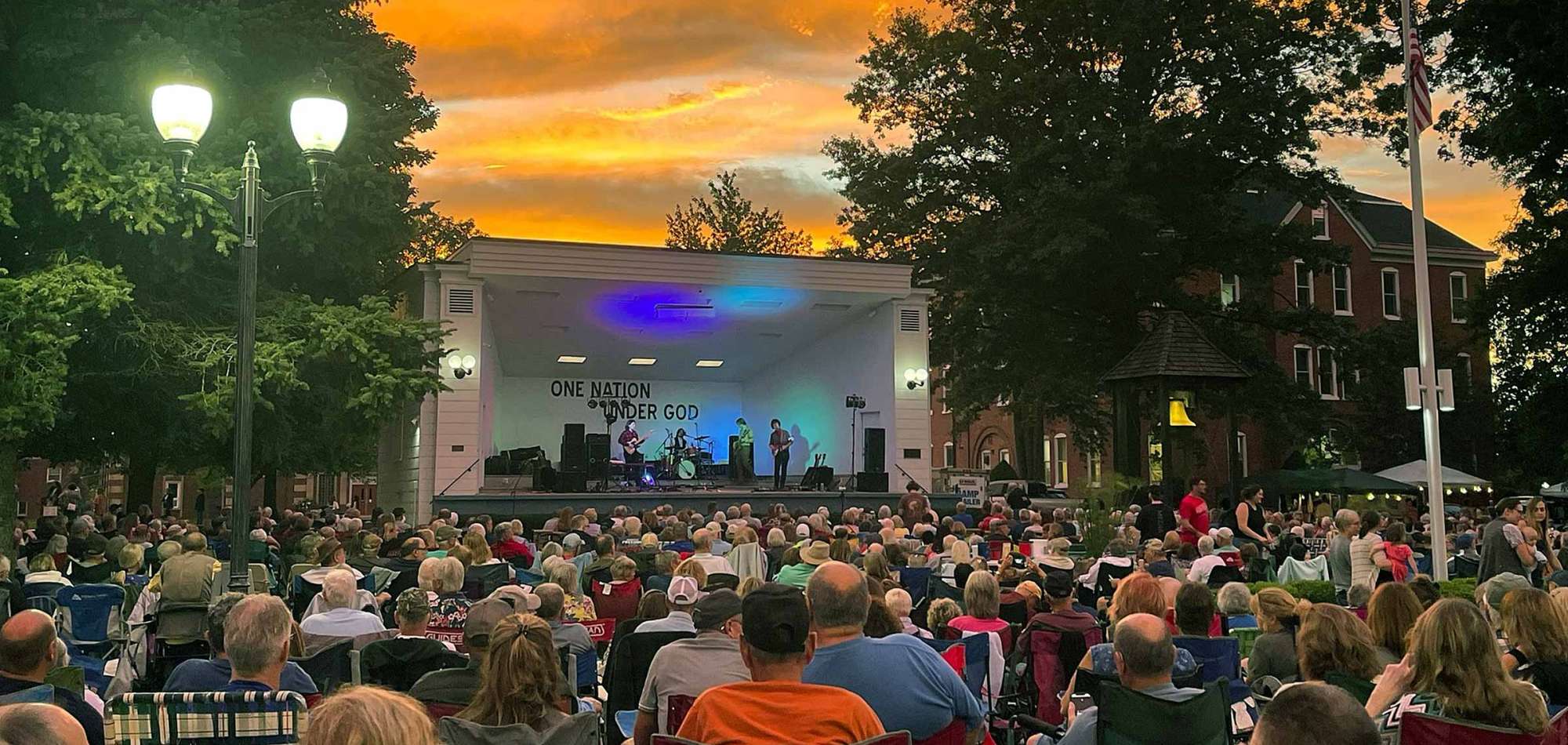 Couple sitting on bench next to Rock River in Oregon, IL